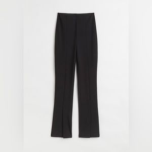 Long black flared pants with slits